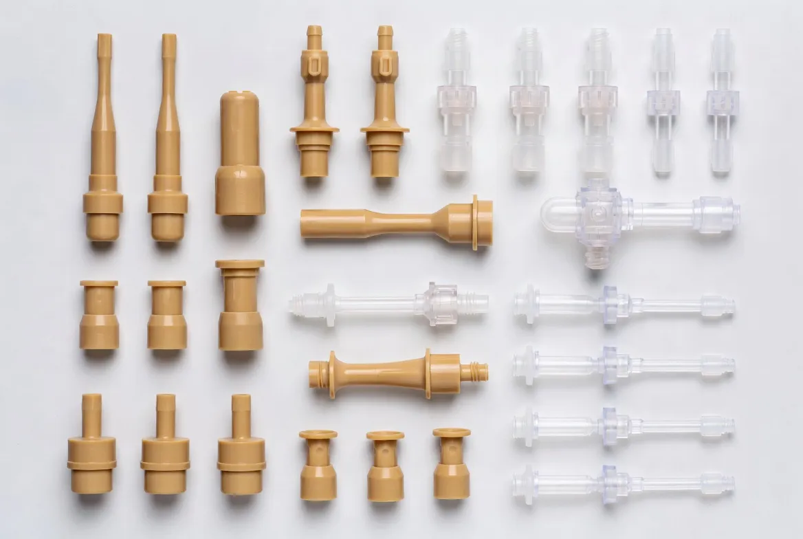 PEEK and medical plastics components for medical devices: spinal implants, surgical guides, fluid-handling components and housings in PEEK, PPSU, PC, POM on clean white background